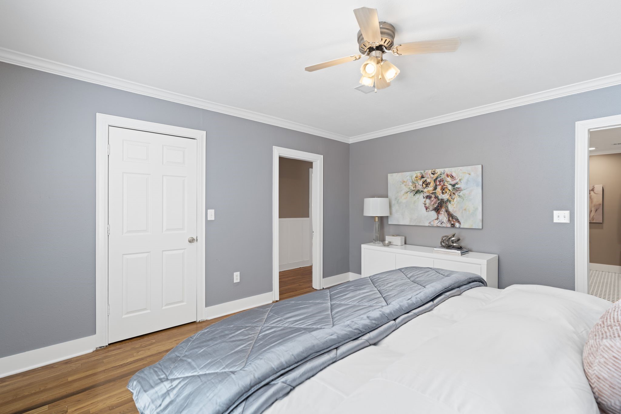 1102 Winston Street Houston, TX 77009 - Photo 15 of 30 a bedroom with a bed and a chandelier