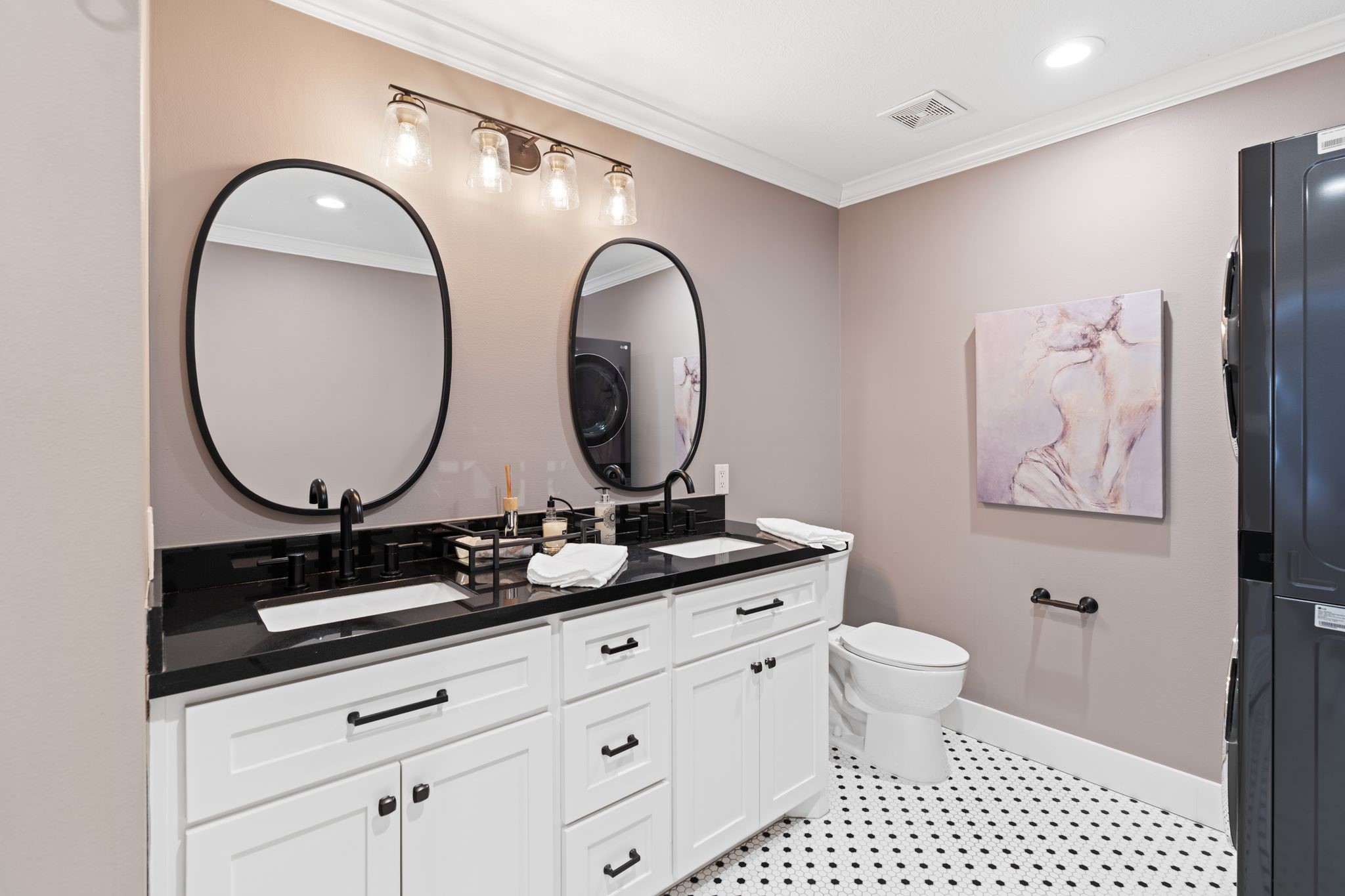 1102 Winston Street Houston, TX 77009 - Photo 16 of 30 a bathroom with a double vanity sink mirror and toilet
