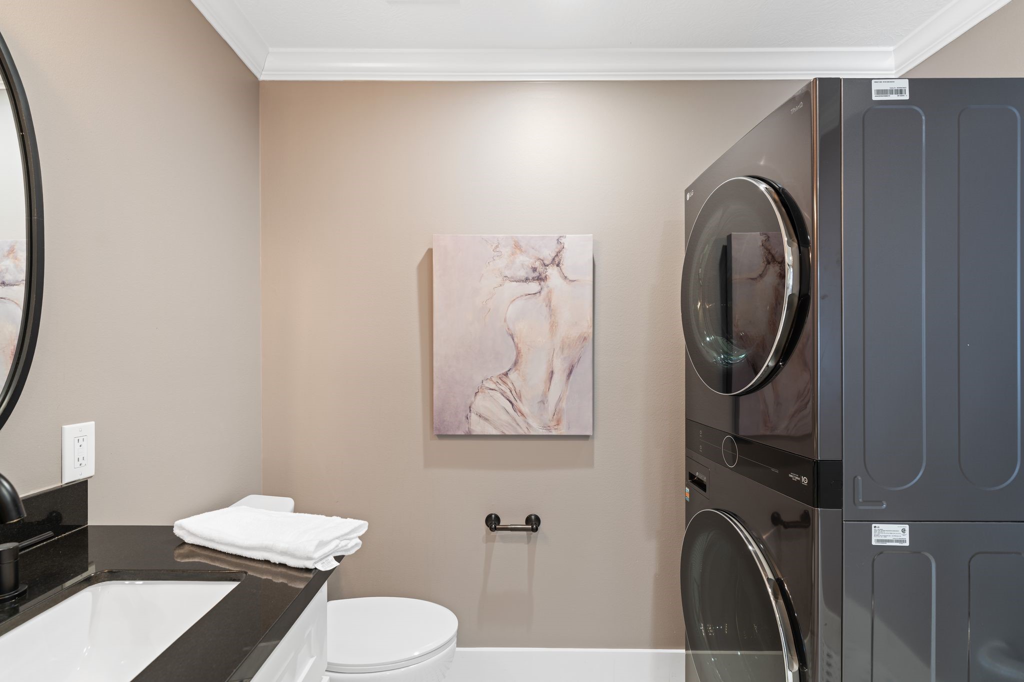 1102 Winston Street Houston, TX 77009 - Photo 18 of 30 a bathroom with a toilet a sink and a mirror