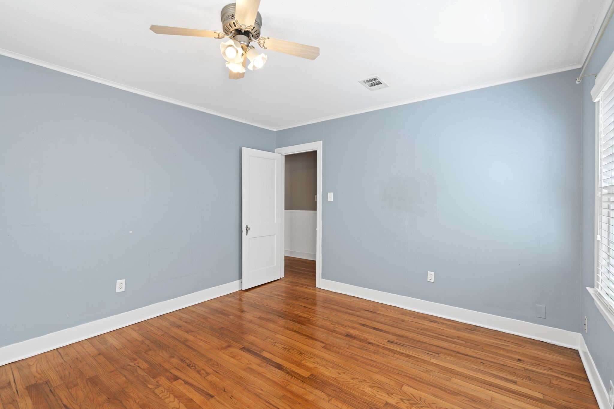1102 Winston Street Houston, TX 77009 - Photo 20 of 30 a view of an empty room with wooden floor