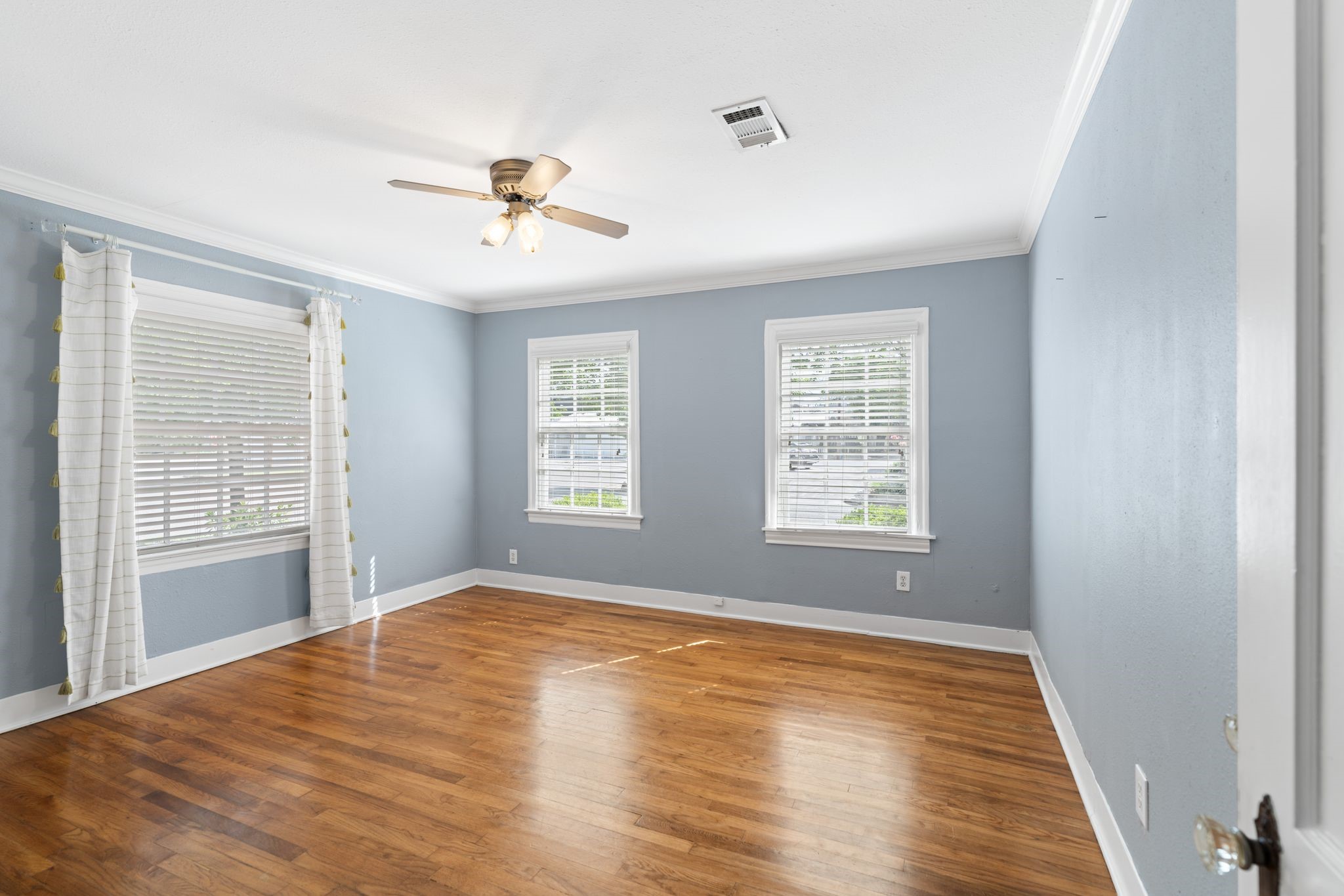 1102 Winston Street Houston, TX 77009 - Photo 23 of 30 a view of empty room with wooden floor and fan