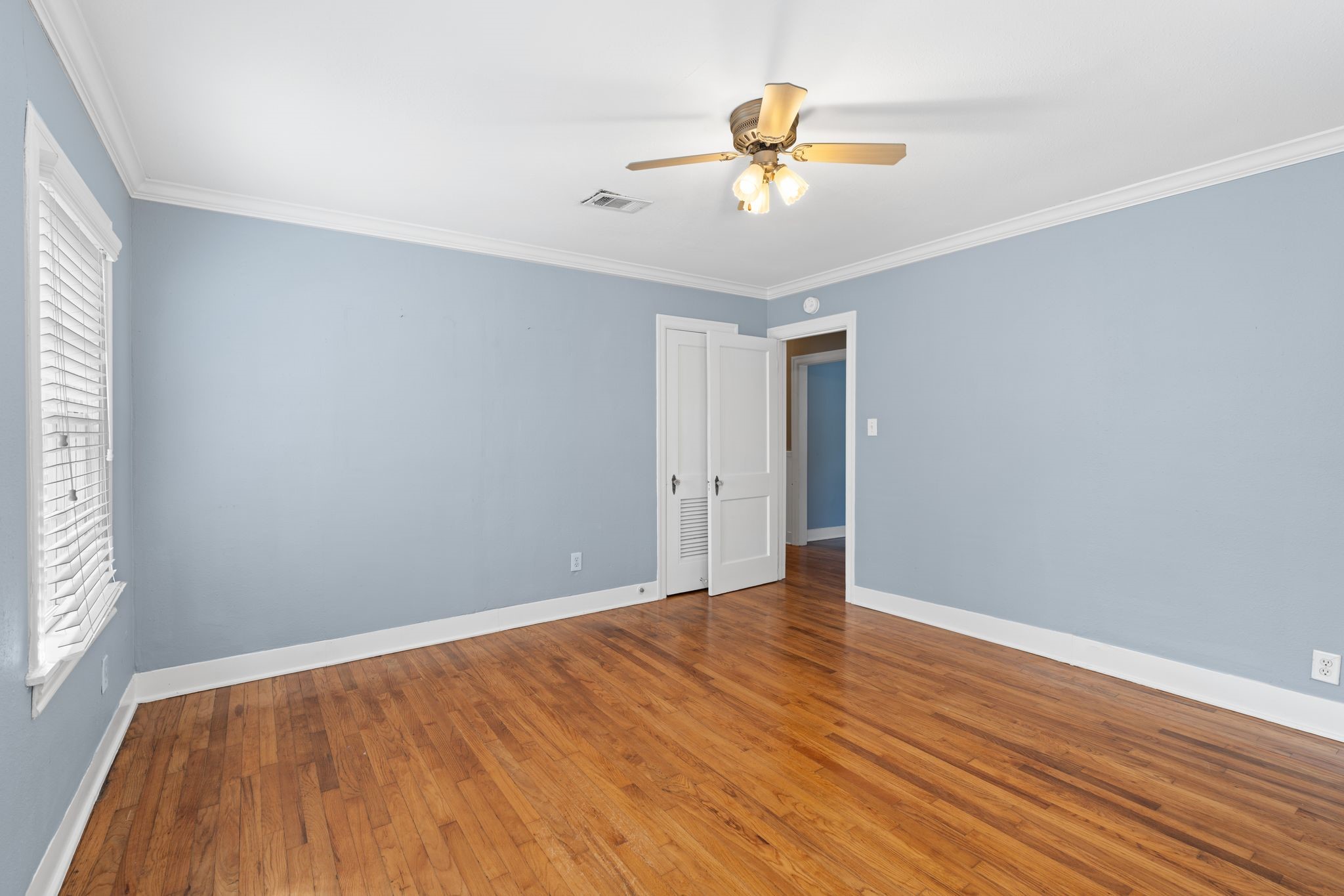 1102 Winston Street Houston, TX 77009 - Photo 24 of 30 wooden floor in an empty room with a window