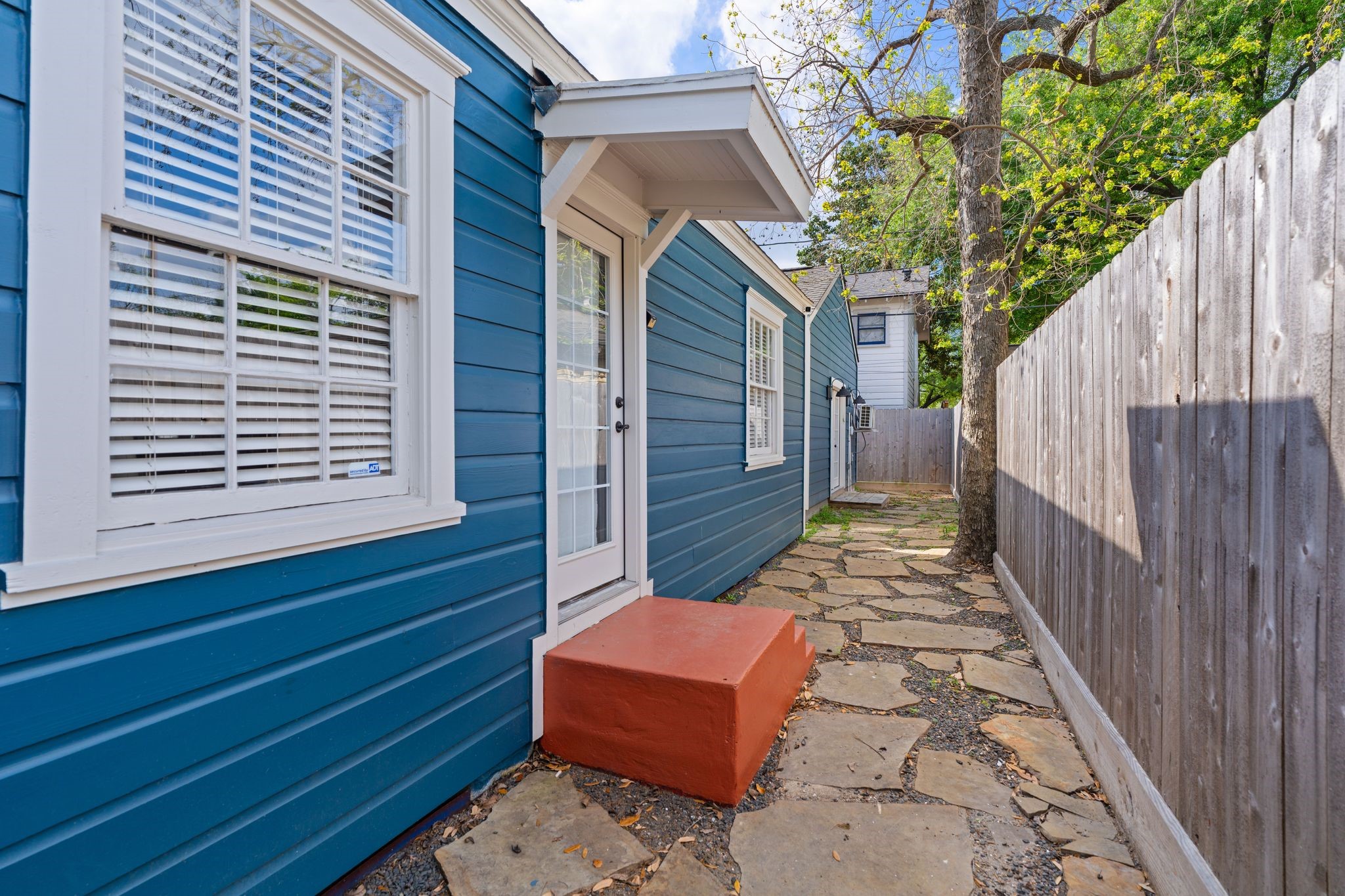 1102 Winston Street Houston, TX 77009 - Photo 26 of 30 a view of a wooden door with a bench