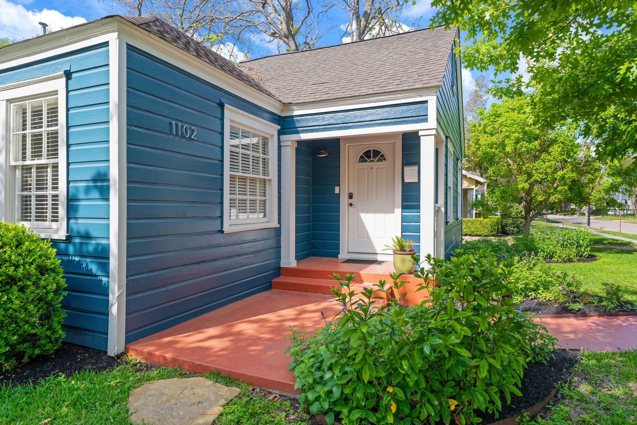 1102 Winston Street Houston, TX 77009 - Photo 27 of 30 a front view of a house with garden