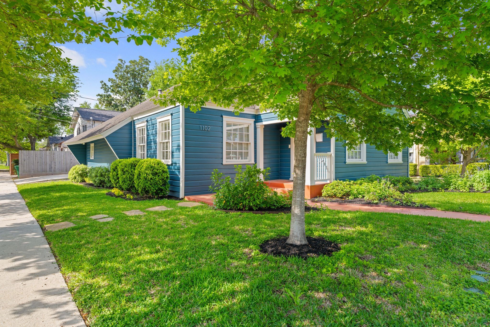 1102 Winston Street Houston, TX 77009 - Photo 28 of 30 a view of a house with backyard and a tree