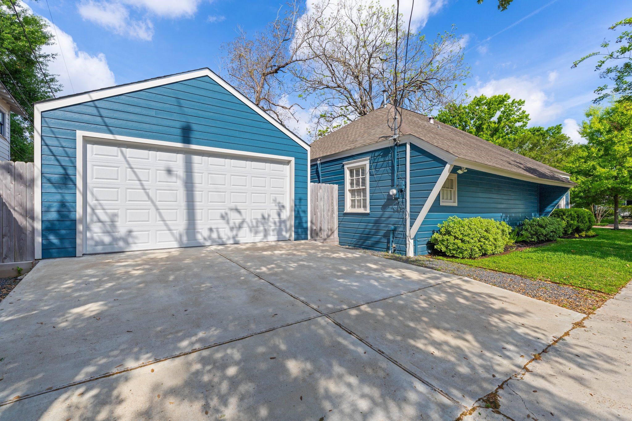 1102 Winston Street Houston, TX 77009 - Photo 29 of 30 a front view of a house with a yard and garage