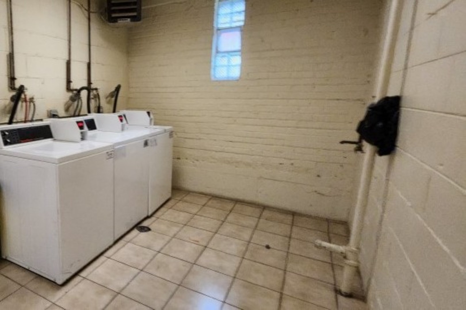 5100 North Sheridan Road, Unit 509 Chicago, IL 60640 - Photo 14 of 16 a bathroom with a sink a toilet and shower