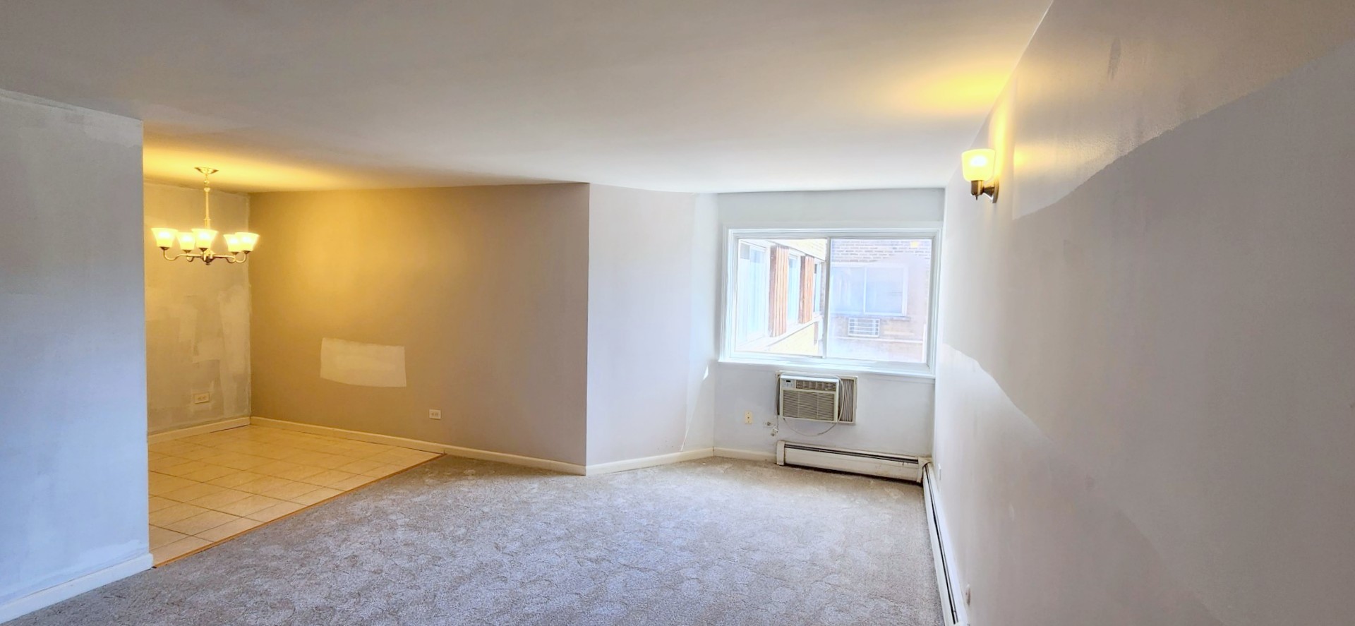 5100 North Sheridan Road, Unit 509 Chicago, IL 60640 - Photo 3 of 16 a view of an empty room with closet and a window