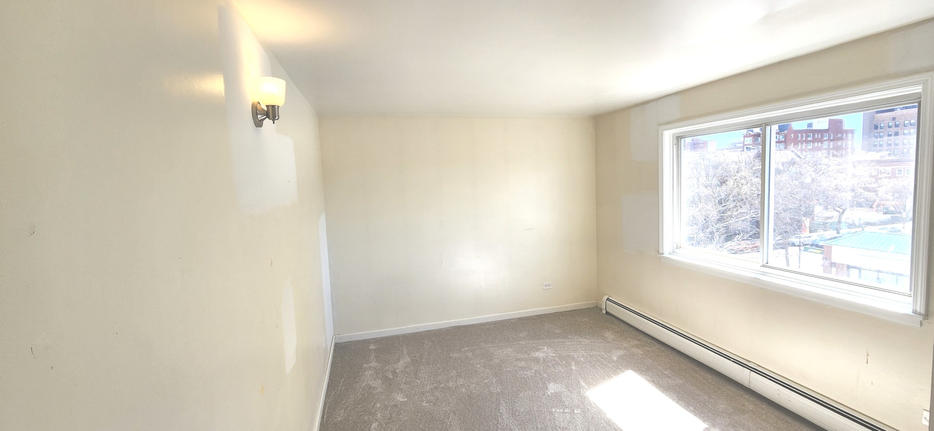 5100 North Sheridan Road, Unit 509 Chicago, IL 60640 - Photo 9 of 16 a view of empty room with window