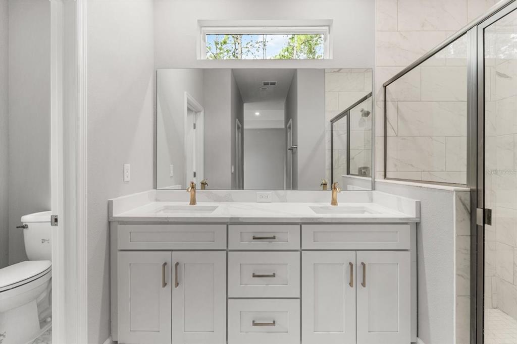 9 Fringetree Street Homosassa, FL 34446 - Photo 19 of 37 a bathroom with a granite countertop sink and a mirror
