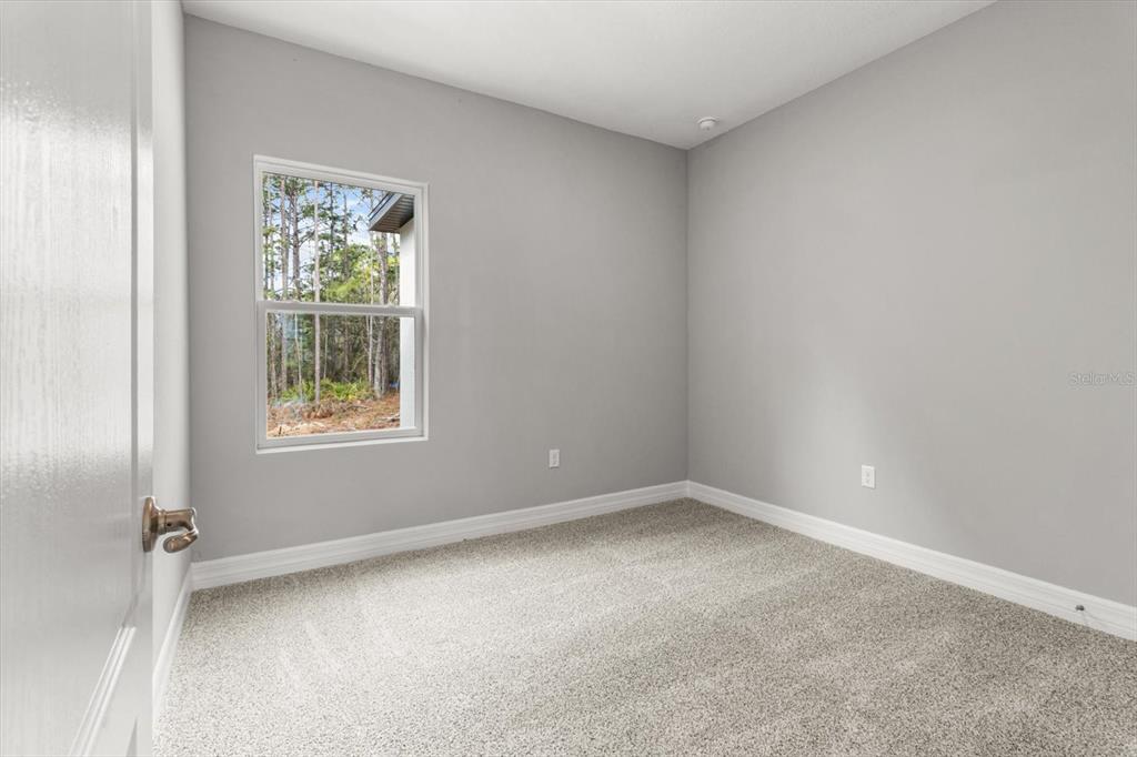 9 Fringetree Street Homosassa, FL 34446 - Photo 21 of 37 an empty room with windows