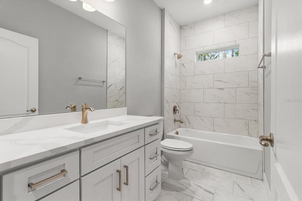 9 Fringetree Street Homosassa, FL 34446 - Photo 23 of 37 a bathroom with a sink a toilet and a bathtub