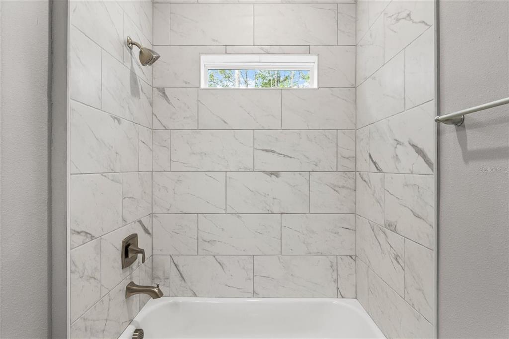 9 Fringetree Street Homosassa, FL 34446 - Photo 24 of 37 a bathroom with a bathtub