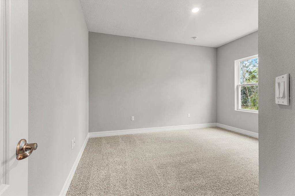 9 Fringetree Street Homosassa, FL 34446 - Photo 25 of 37 an empty room with windows