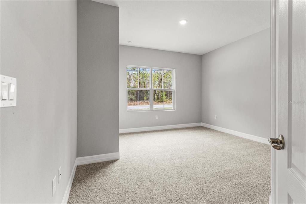 9 Fringetree Street Homosassa, FL 34446 - Photo 27 of 37 an empty room with windows