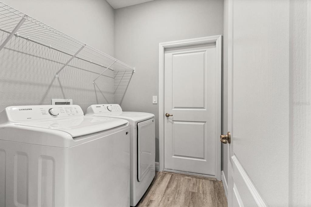 9 Fringetree Street Homosassa, FL 34446 - Photo 31 of 37 a utility room with dryer and washer
