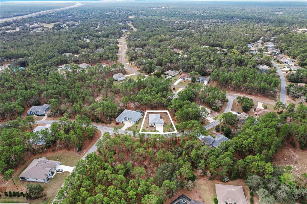 9 Fringetree Street Homosassa, FL 34446 - Photo 35 of 37 an aerial view of a house with a yard