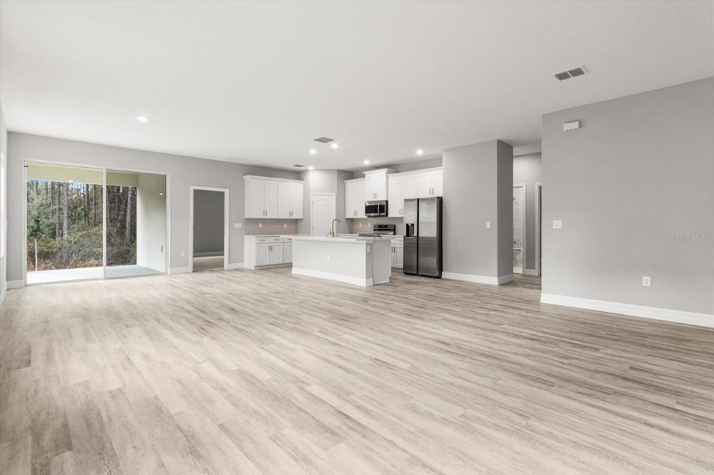 9 Fringetree Street Homosassa, FL 34446 - Photo 9 of 37 a view of a kitchen with a sink and a refrigerator