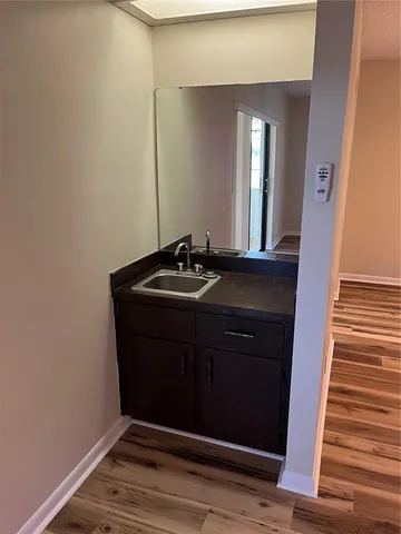a room with a sink and a mirror