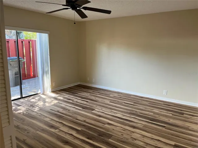 a view of a livingroom with wooden floor and closet