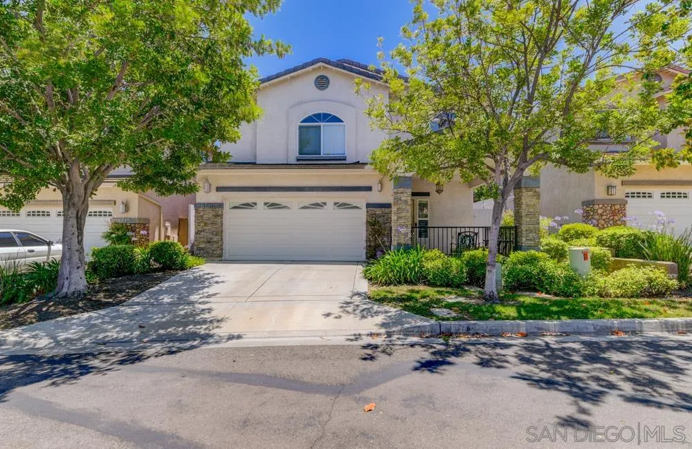 8713 Glen Oaks Way Santee, CA 92071 - Photo 1 of 22 a front view of a house with a yard and garage