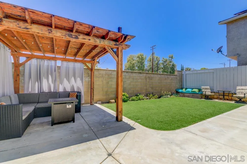 8713 Glen Oaks Way Santee, CA 92071 - Photo 19 of 22 a backyard of a house with yard and outdoor seating