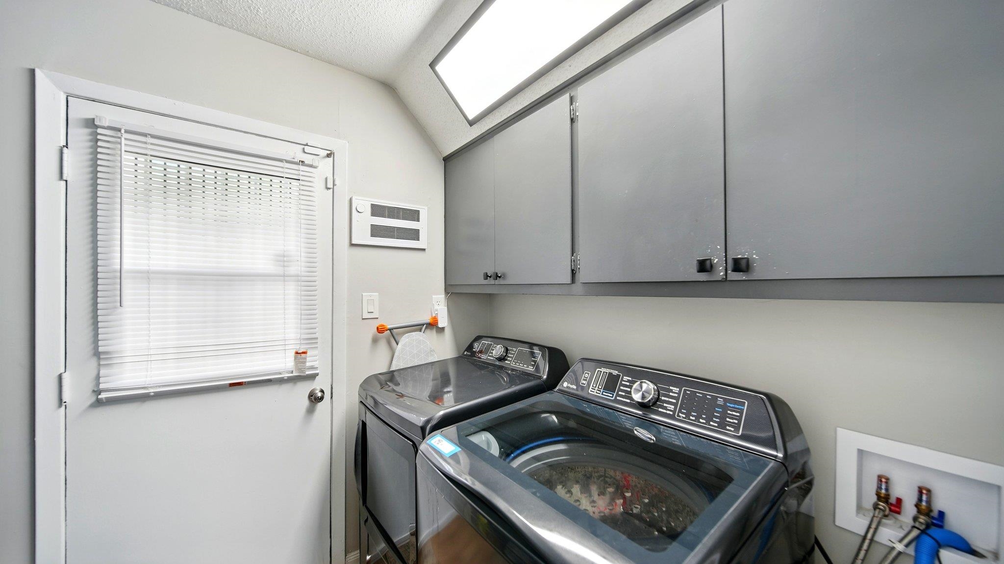 359 South Fenwick Road Memphis, TN 38111 - Photo 25 of 31 Laundry room with cabinet space and washing machine and dryer