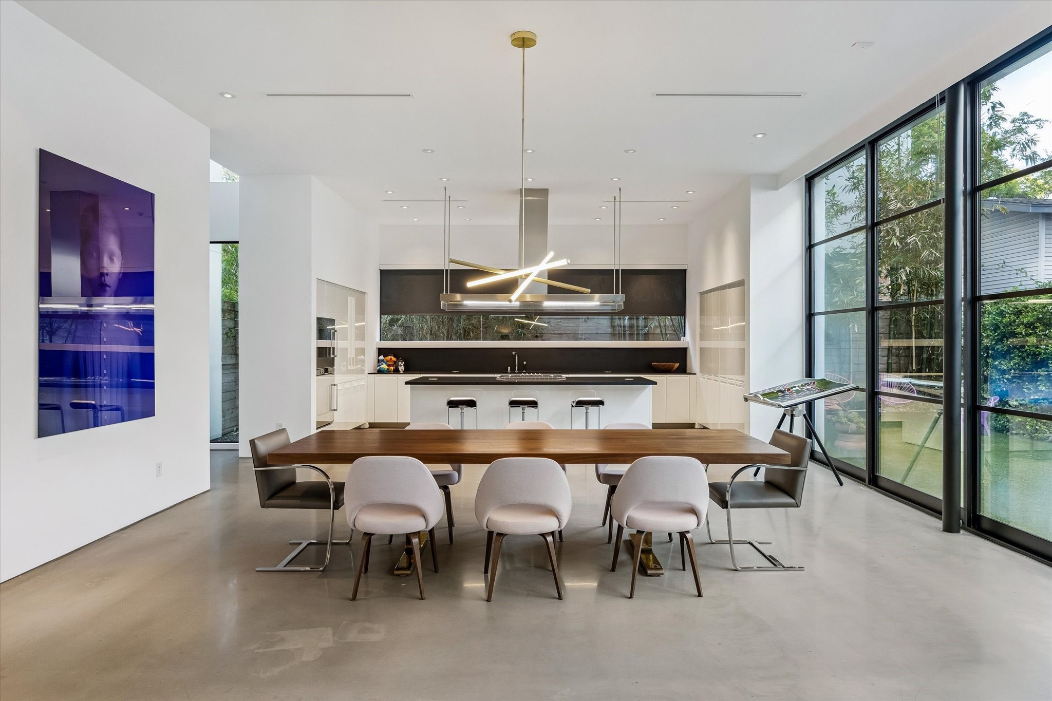 1527 Indiana Street Houston, TX 77006 - Photo 7 of 30 Dining room - with its 11-foot ceiling and designer chandelier; can host memorable dinner parties with additional bar seating available.