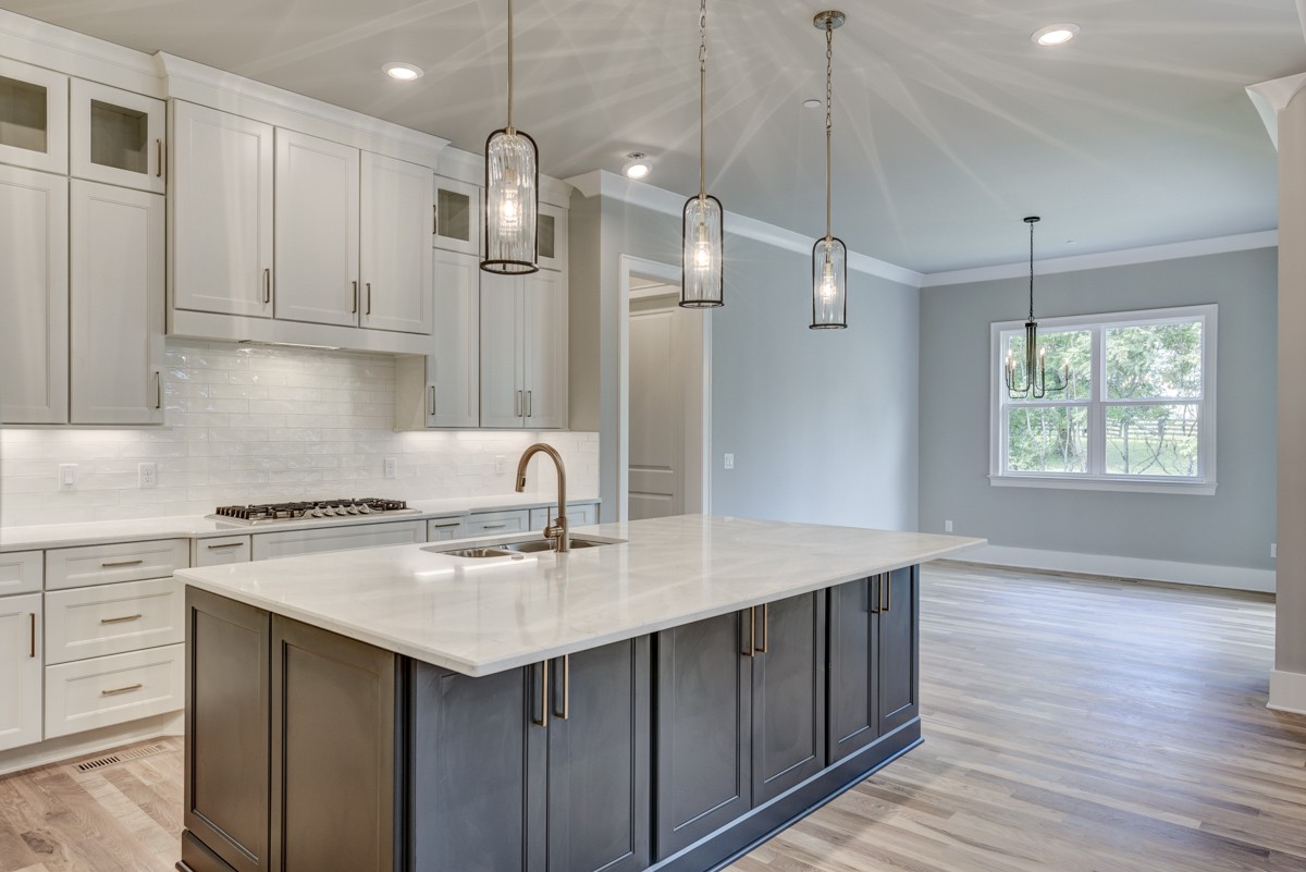 237 Circuit Road Franklin, TN 37064 - Photo 18 of 47 a kitchen with a sink a stove a refrigerator and white cabinets