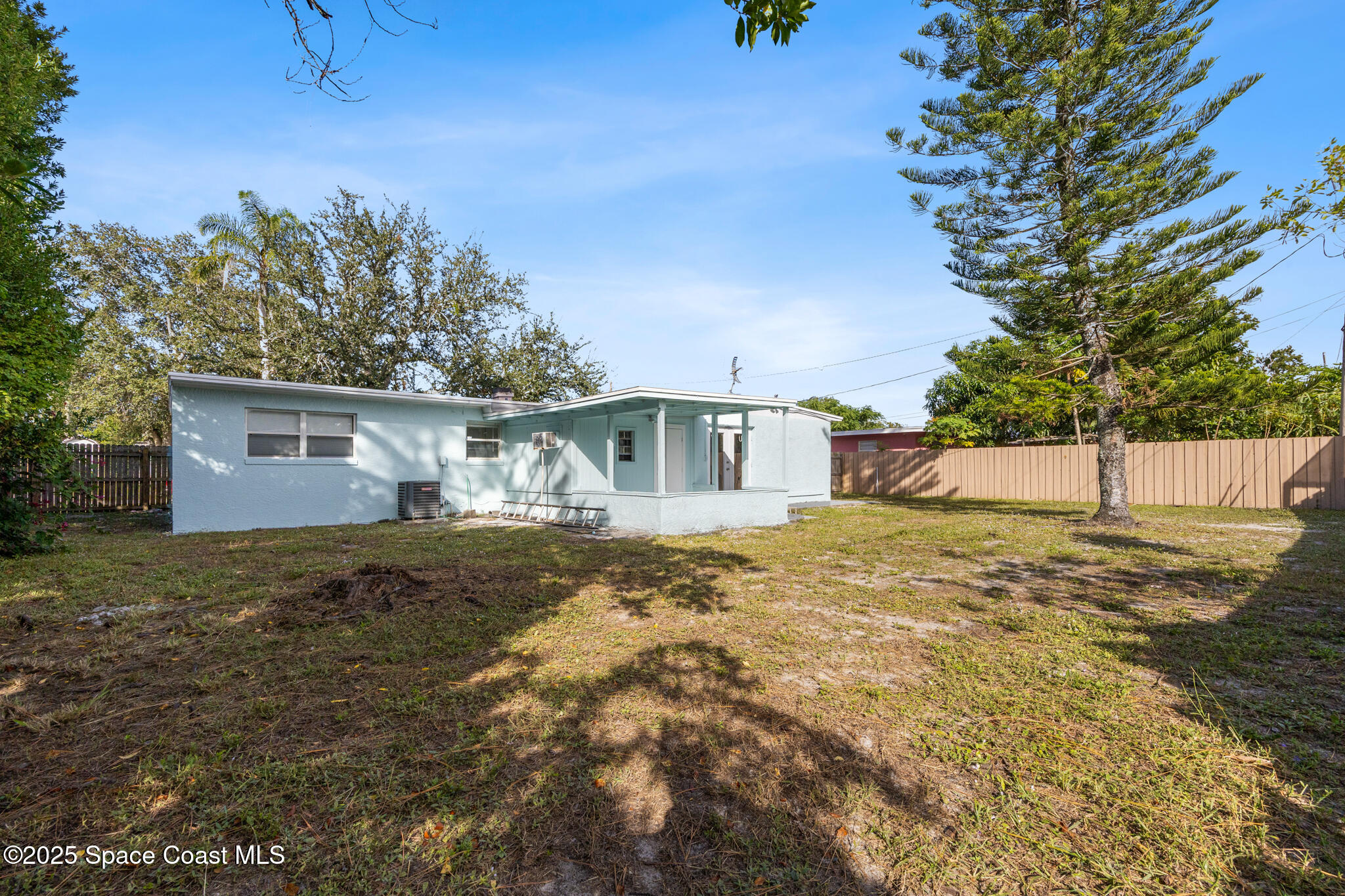 1107 Alamanda Lane Cocoa, FL 32922 - Photo 23 of 24 a view of a house with a yard