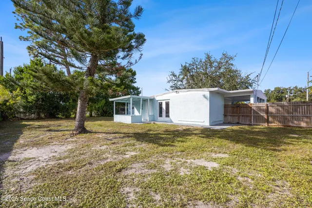 a house with trees in the background