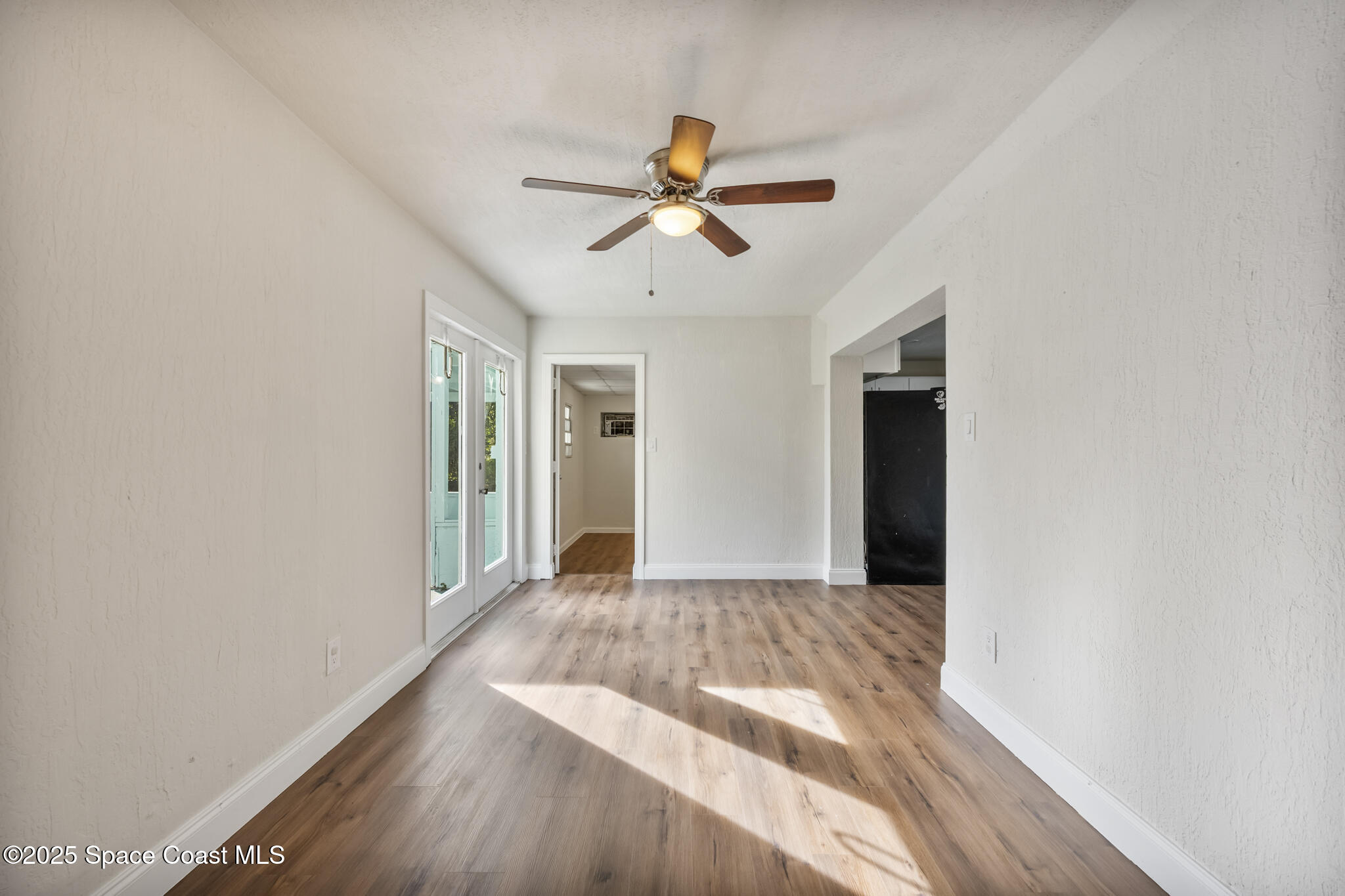 1107 Alamanda Lane Cocoa, FL 32922 - Photo 10 of 24 a view of empty room with wooden floor and fan