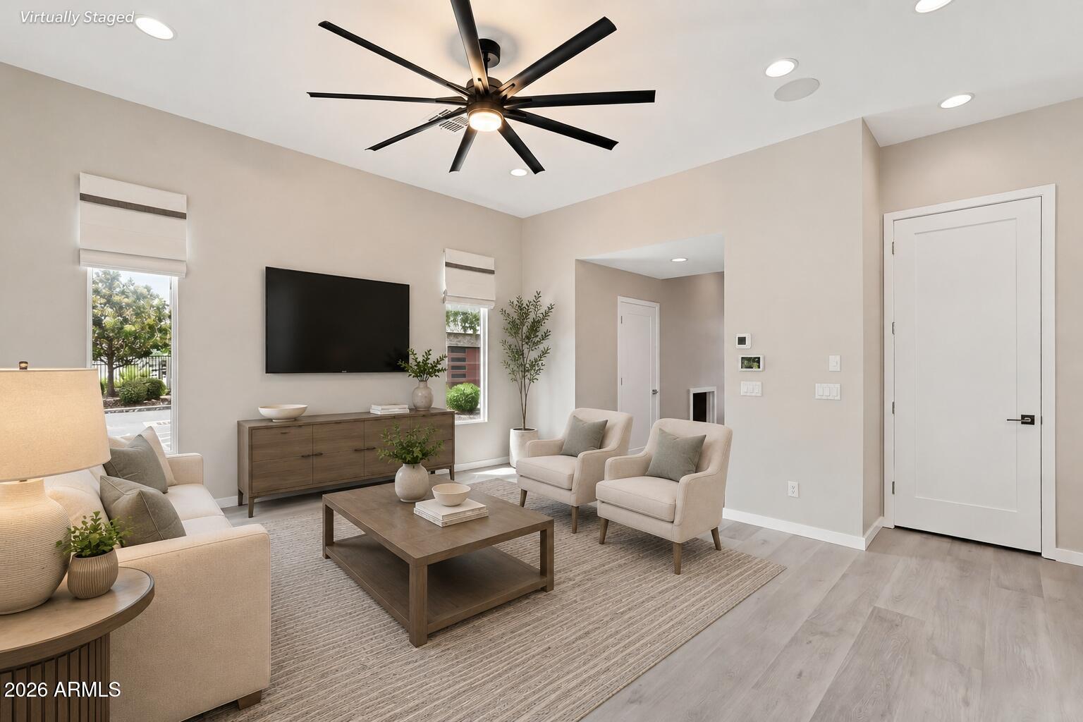 901 South Smith Road, Unit 1038 Tempe, AZ 85281 - Photo 8 of 29 a living room with furniture and a flat screen tv