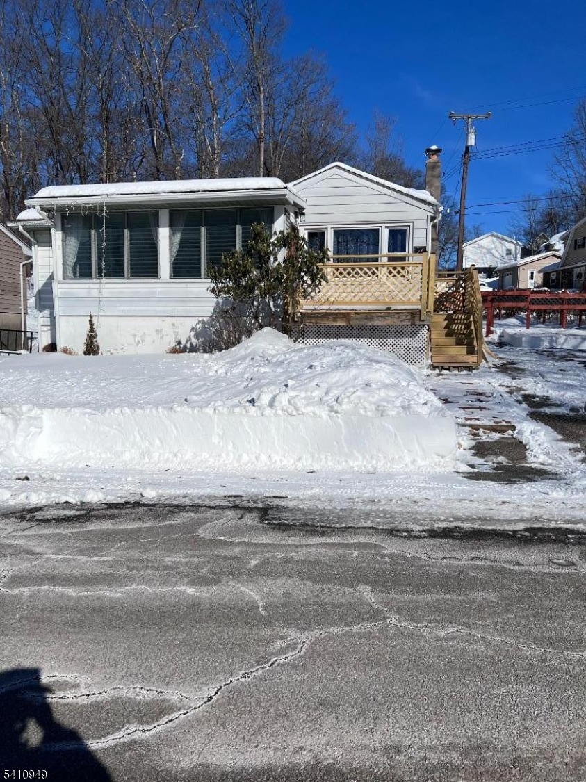 126 Metro Trail Hopatcong, NJ 07843 - Photo 1 of 14 a front view of a house with yard