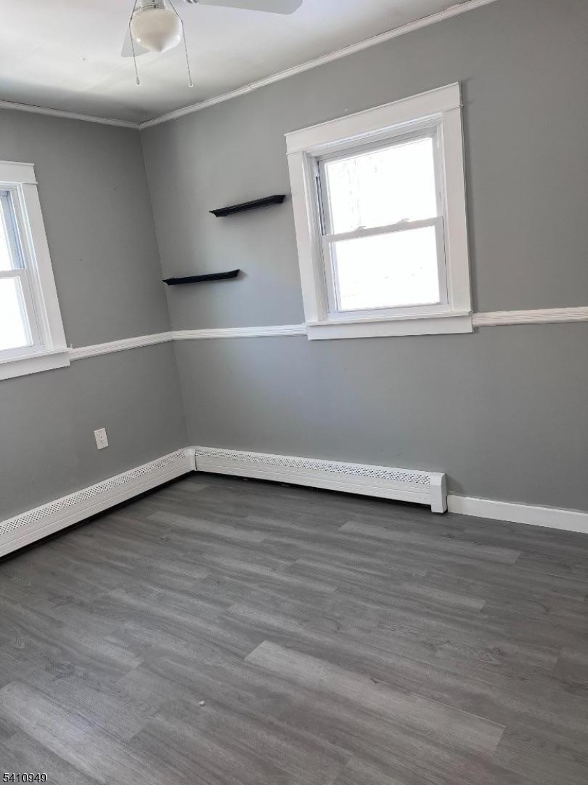 126 Metro Trail Hopatcong, NJ 07843 - Photo 12 of 14 a view of an empty room with wooden floor and a window