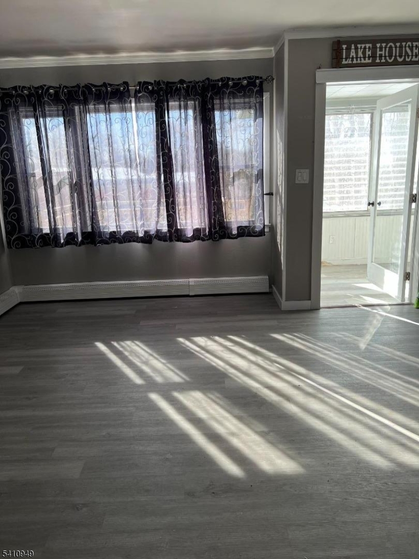 126 Metro Trail Hopatcong, NJ 07843 - Photo 4 of 14 a view of room with window and hardwood floor
