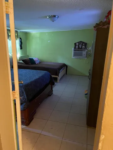 a room with furniture and a flat screen tv