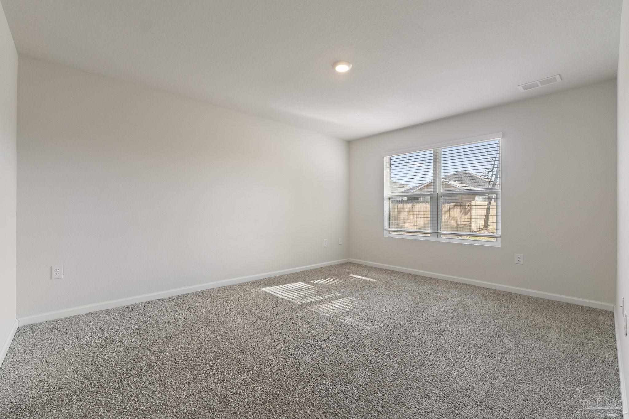 8669 Pathstone Boulevard Pensacola, FL 32526 - Photo 20 of 36 an empty room with windows