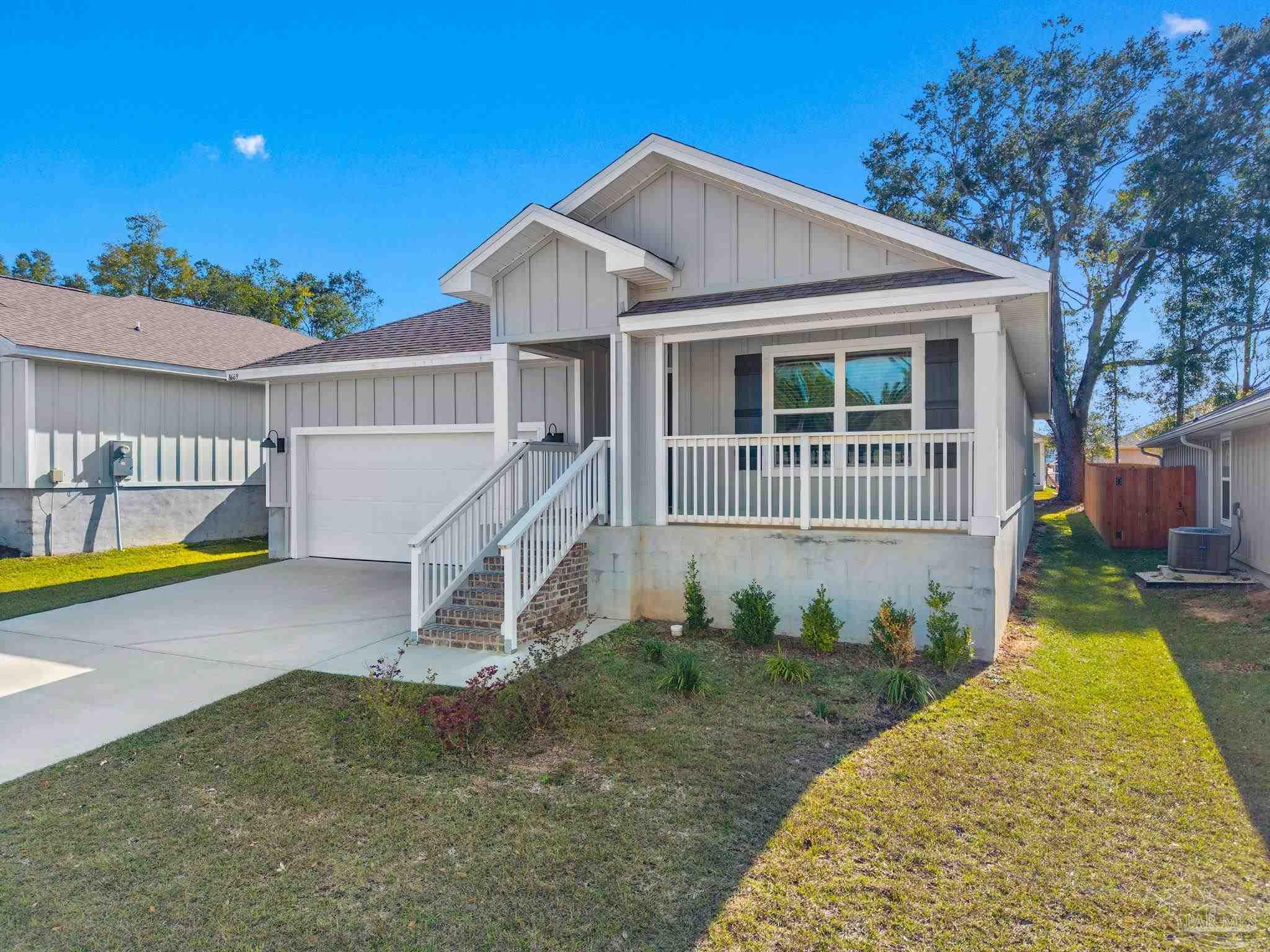8669 Pathstone Boulevard Pensacola, FL 32526 - Photo 2 of 36 a house view with a garden space