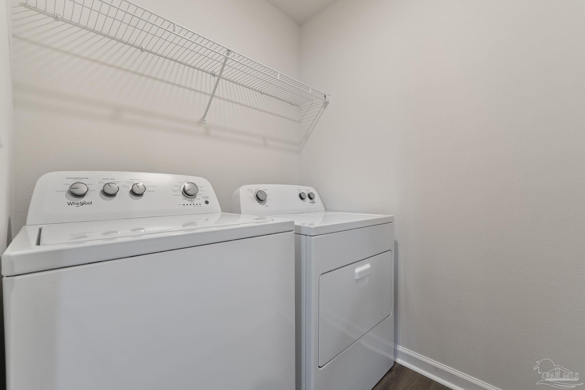 8669 Pathstone Boulevard Pensacola, FL 32526 - Photo 24 of 36 a utility room with dryer and washer