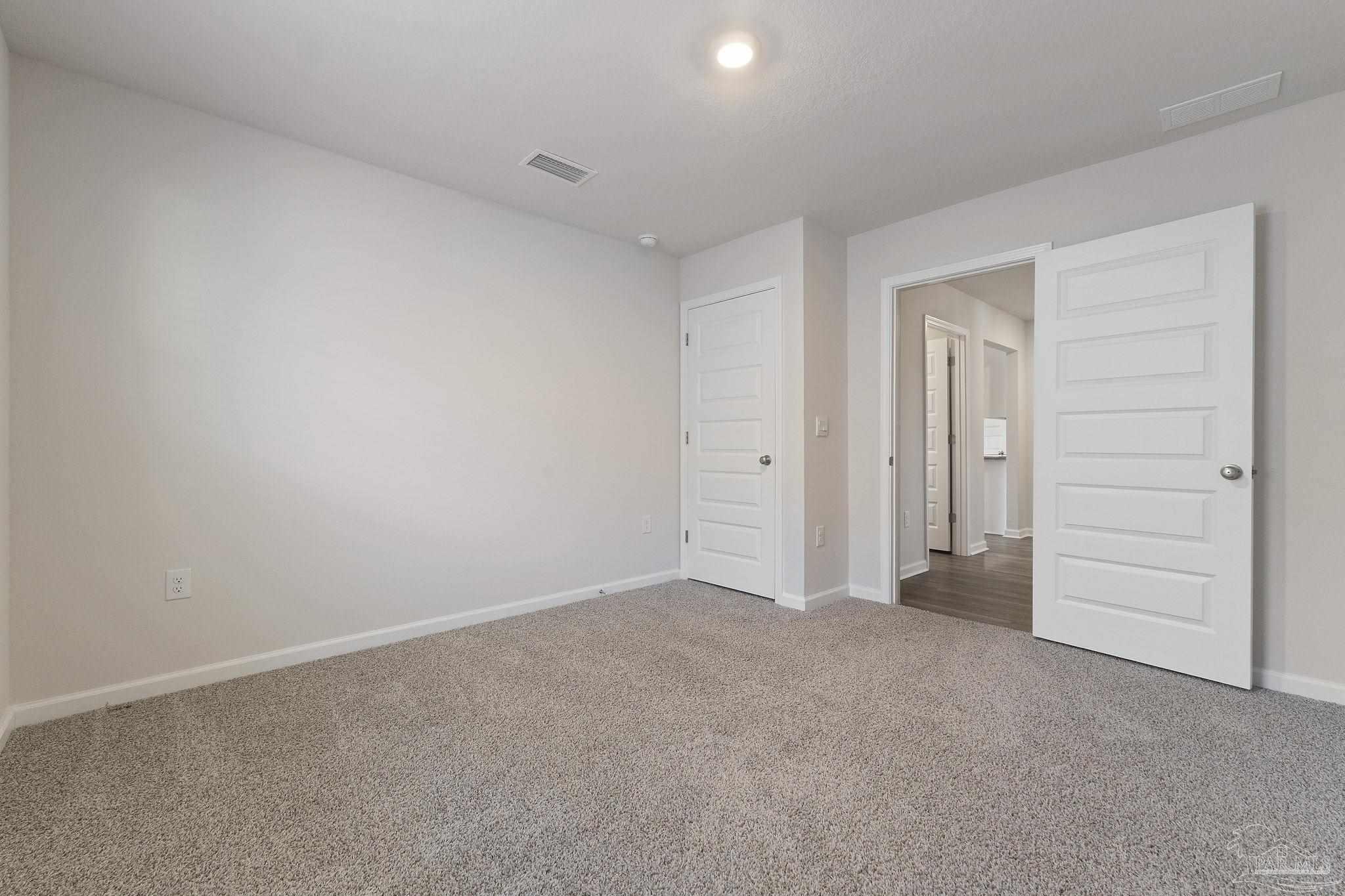 8669 Pathstone Boulevard Pensacola, FL 32526 - Photo 25 of 36 a view of an empty room and closet area