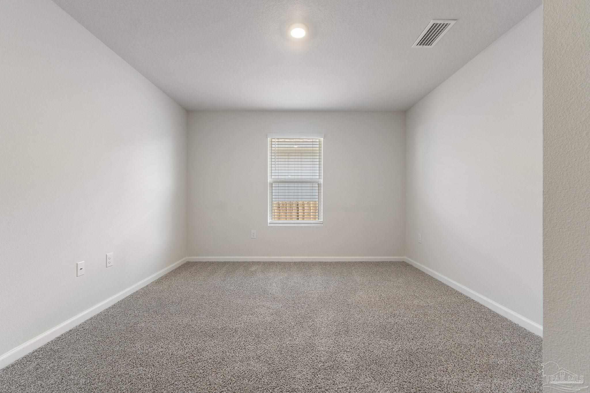 8669 Pathstone Boulevard Pensacola, FL 32526 - Photo 26 of 36 a view of an empty room with a window