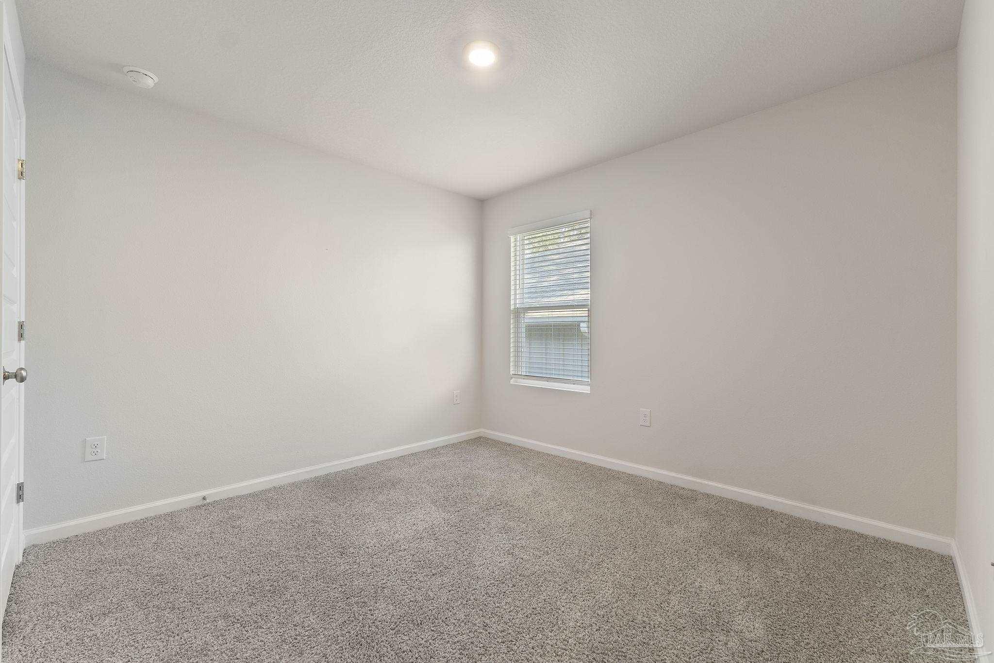 8669 Pathstone Boulevard Pensacola, FL 32526 - Photo 28 of 36 an empty room with a window
