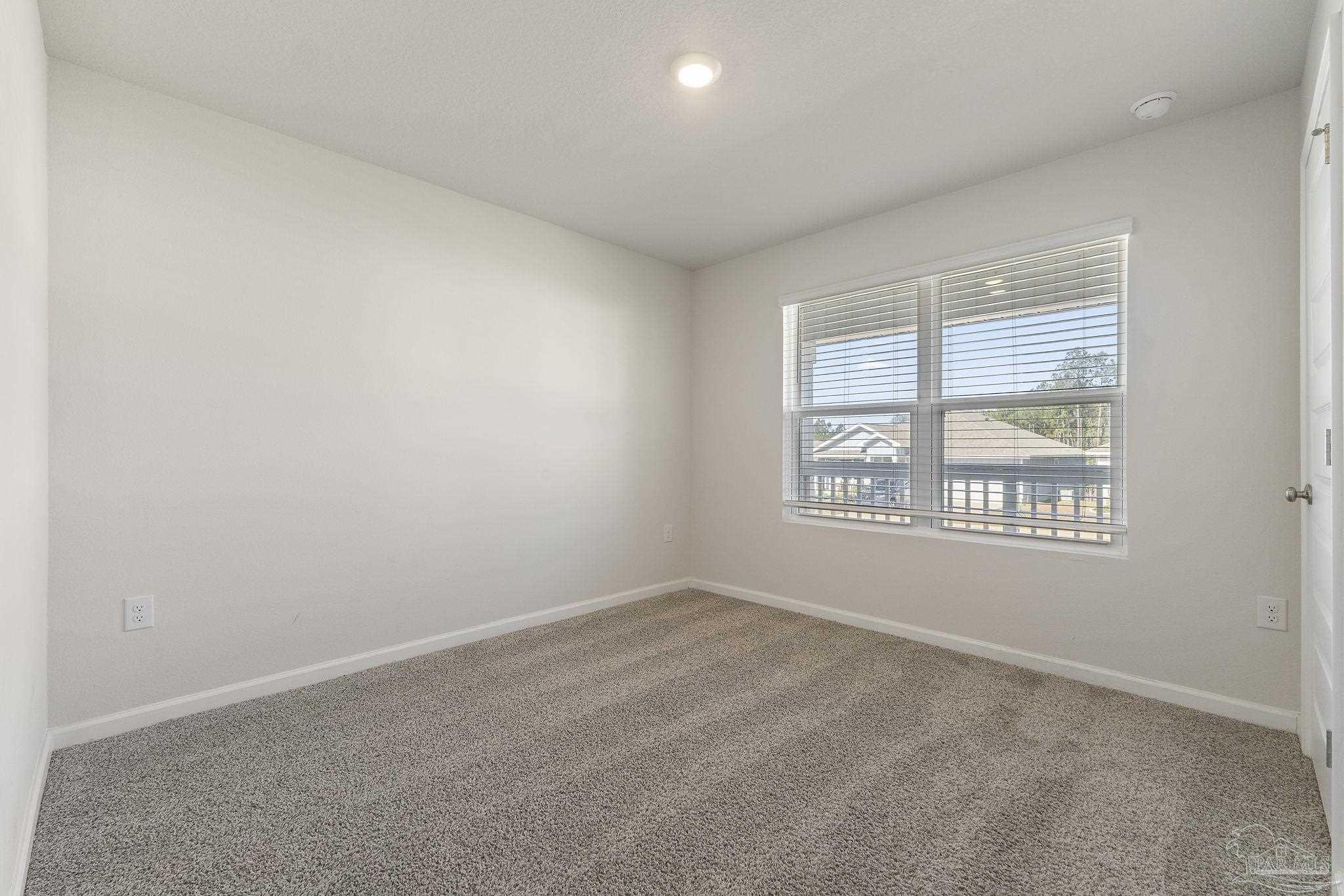 8669 Pathstone Boulevard Pensacola, FL 32526 - Photo 30 of 36 an empty room with a window