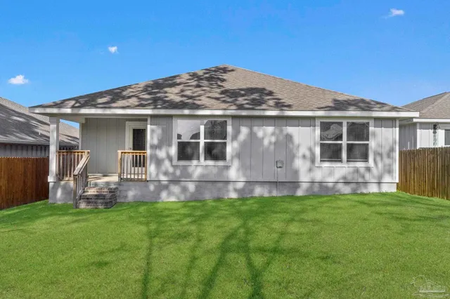 a view of a house with a swimming pool and porch