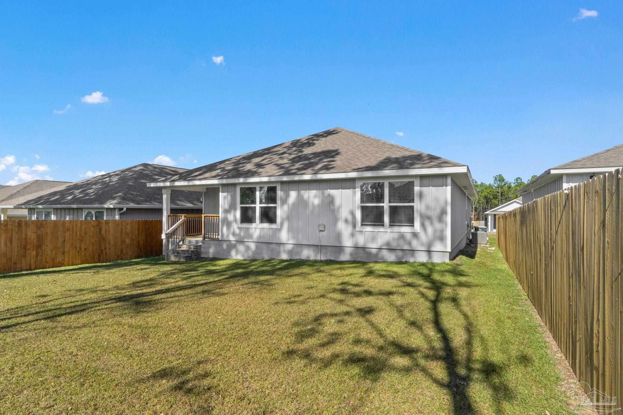 8669 Pathstone Boulevard Pensacola, FL 32526 - Photo 33 of 36 a view of a house with a swimming pool and porch