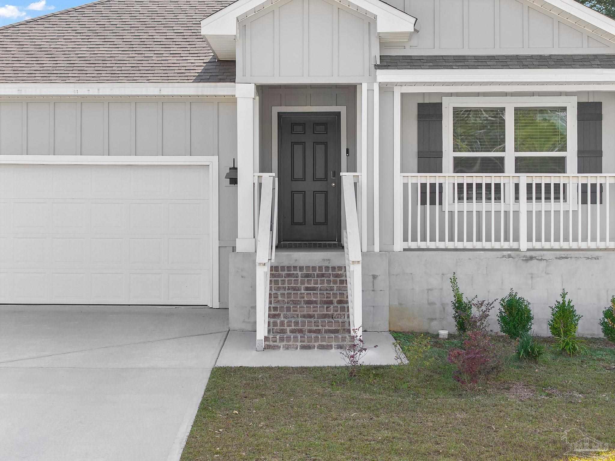8669 Pathstone Boulevard Pensacola, FL 32526 - Photo 4 of 36 front view of a house with a window