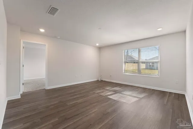 a view of a kitchen with wooden floor