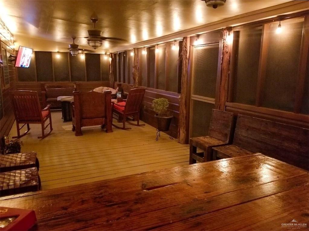 2938 Highway 83 Roma, TX 78584 - Photo 18 of 23 Home theater with light wood-style flooring and ceiling fan
