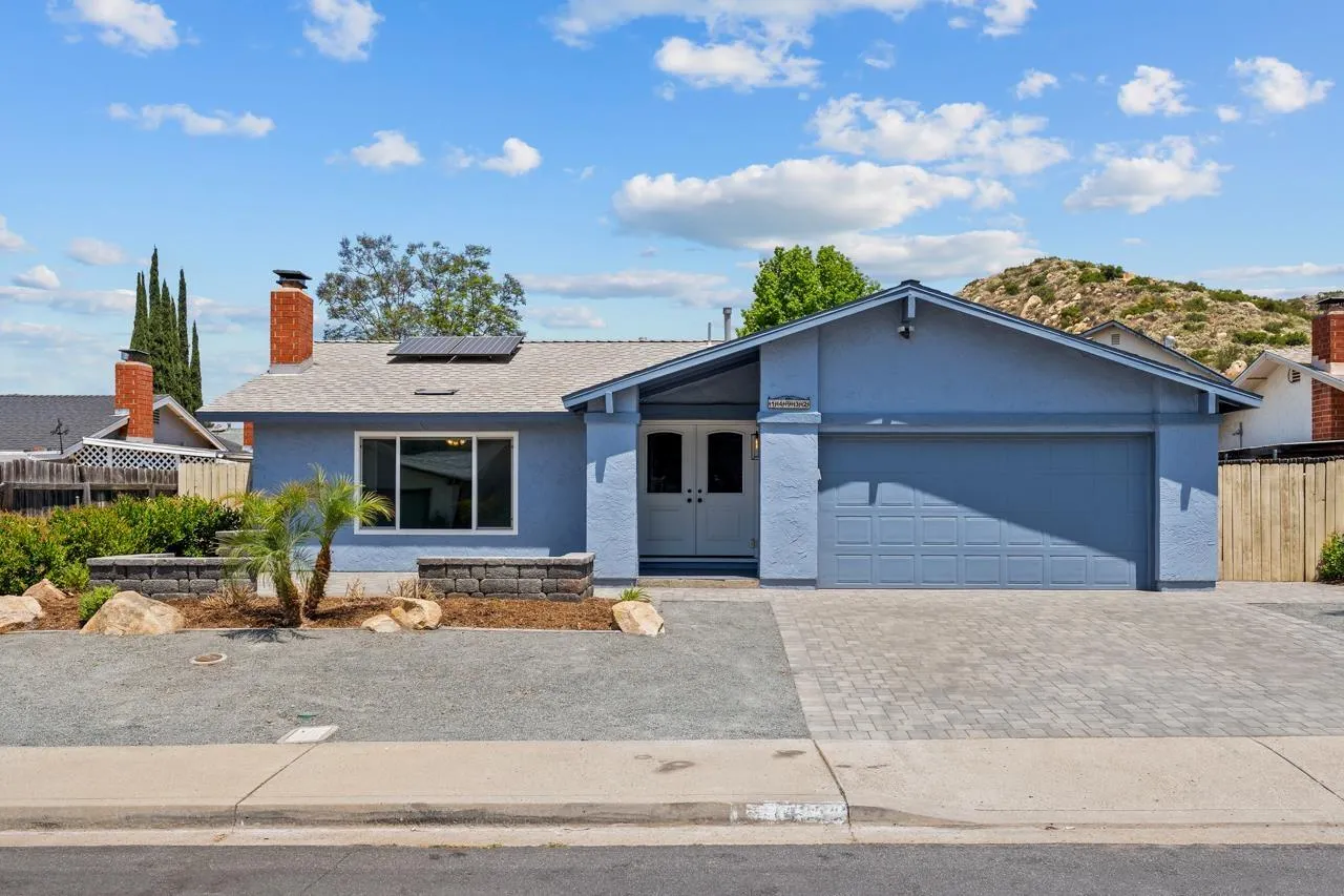 14932 Cinchring Drive Poway, CA 92064 - Photo 2 of 14 a front view of a house with garden